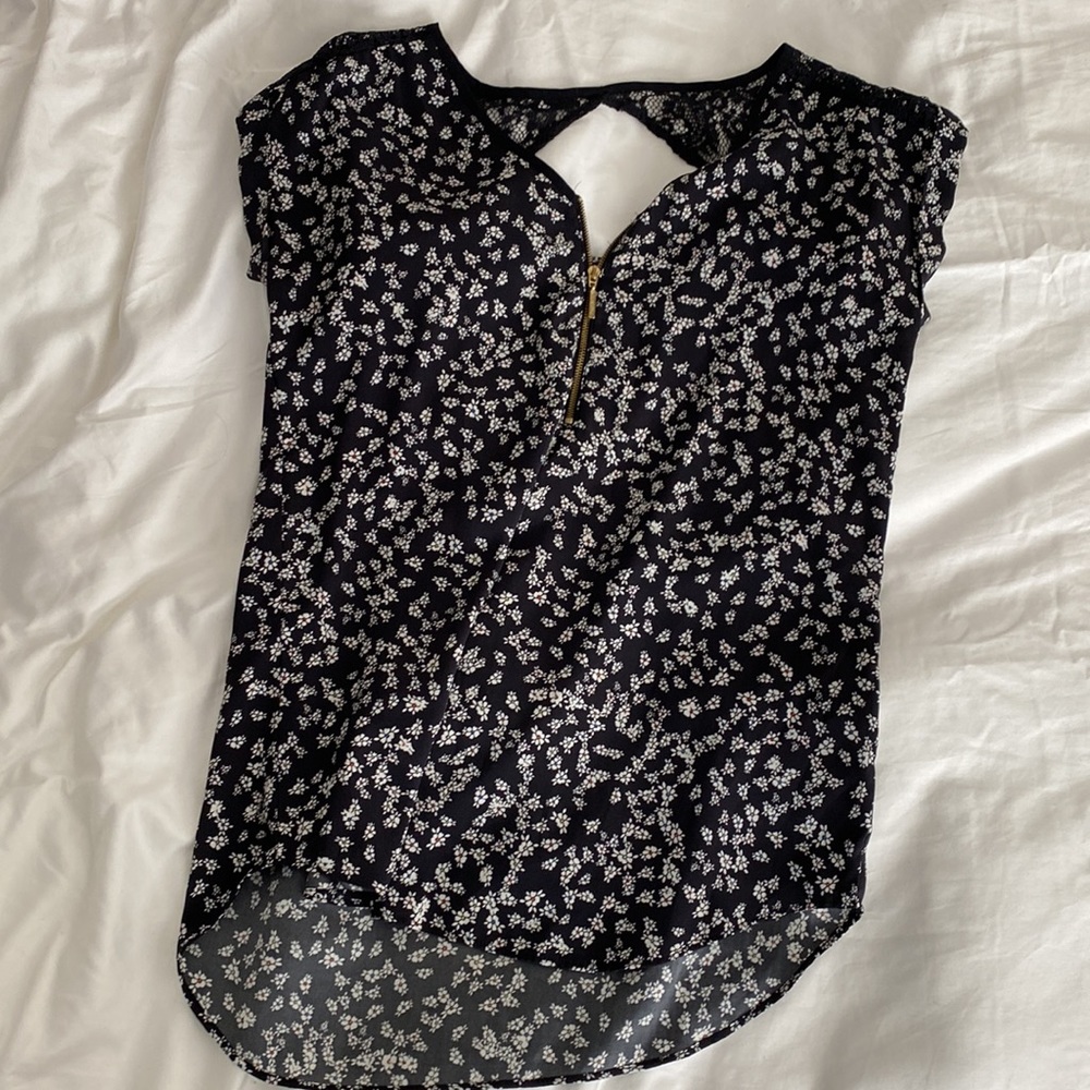 Two Express tops. Cold Shoulder Top and Floral Top with zipper detail